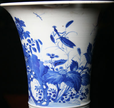 Blue and white porcelain flower container with a praying mantis design